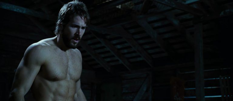 Actor Ryan Reynolds shirtless in The Amityville Horror movie