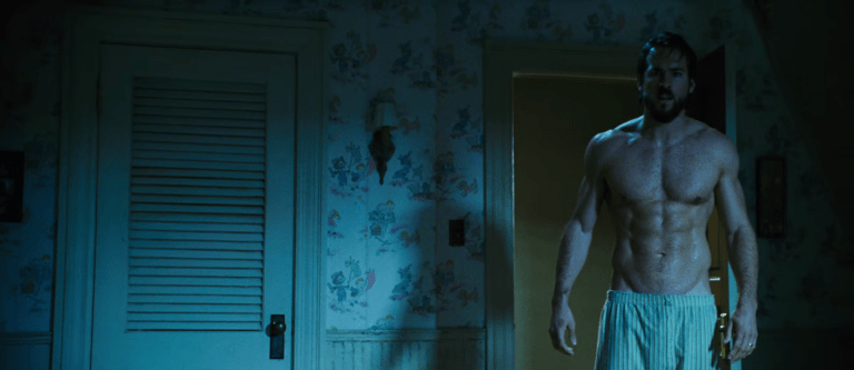 Hot American actor Ryan Reynolds shirtless in the bedroom