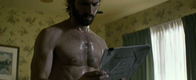 Shirtless actor Michiel Huisman in a towel