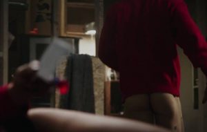 Ryan Reynolds shows his naked butt and some tattoos in a scene from Deadpool
